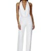 Combinaison blanche paillettes argentées col halter décolleté V
