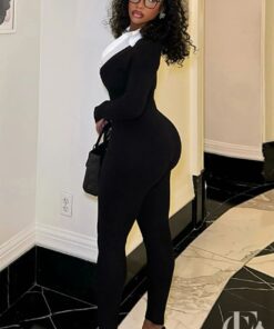 Combinaison femme habillée professionnelle noire ajustée ceinturée
