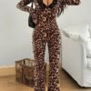 Combinaison léopard transparente dentelle noire pattes évasées soirée